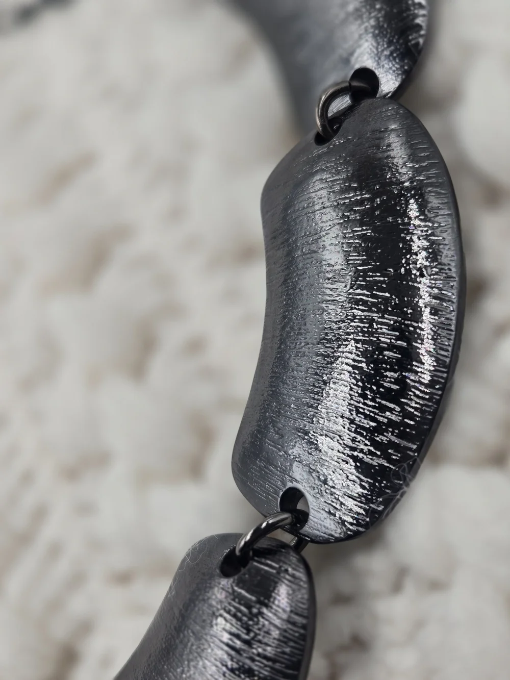 Heidi Klum silver tone textured necklace featuring brushed metal links.